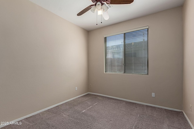 unfurnished room featuring baseboards, carpet, and a ceiling fan