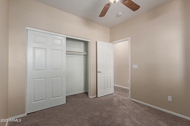 unfurnished bedroom featuring a closet, a ceiling fan, baseboards, and carpet floors