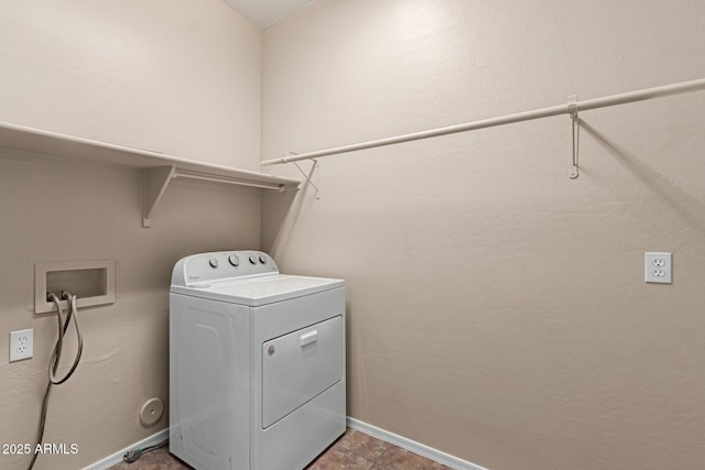 washroom with washer / dryer, baseboards, and laundry area