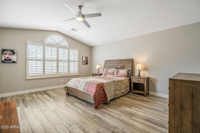 bedroom with lofted ceiling, wood finished floors, baseboards, and ceiling fan