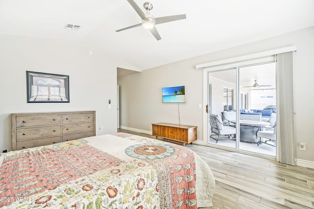 bedroom with access to exterior, wood finished floors, lofted ceiling, baseboards, and ceiling fan