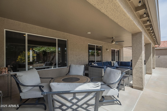 view of patio with outdoor lounge area and ceiling fan