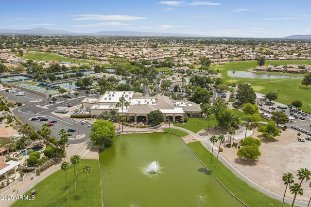 aerial view of residential area featuring a water and mountain view