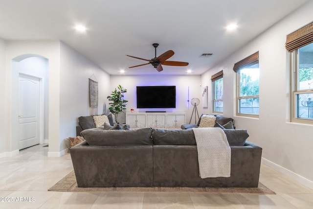 living room with recessed lighting, visible vents, ceiling fan, and baseboards