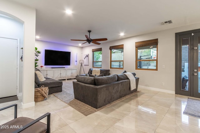 living area featuring baseboards, visible vents, ceiling fan, and recessed lighting