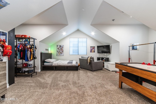 recreation room with lofted ceiling and carpet flooring