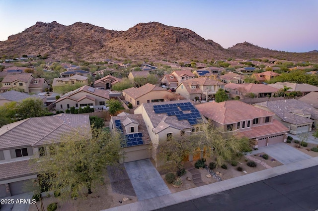 drone / aerial view featuring a mountain view and a residential view