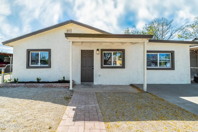 view of front of home featuring stucco siding