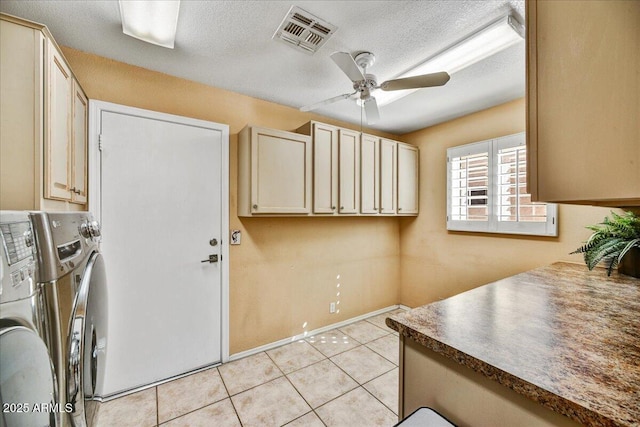 laundry area featuring light tile patterned floors, washing machine and clothes dryer, ceiling fan, visible vents, and cabinet space