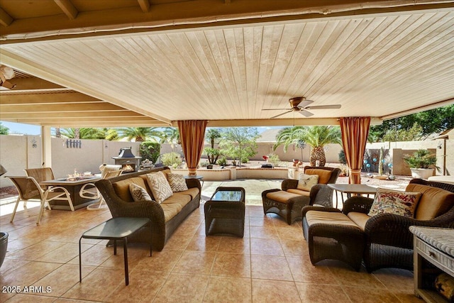 view of patio with an outdoor hangout area, ceiling fan, and a fenced backyard