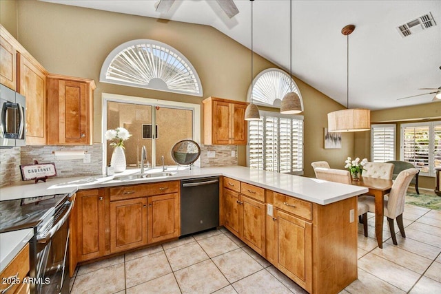 kitchen with a sink, visible vents, dishwasher, a peninsula, and ceiling fan