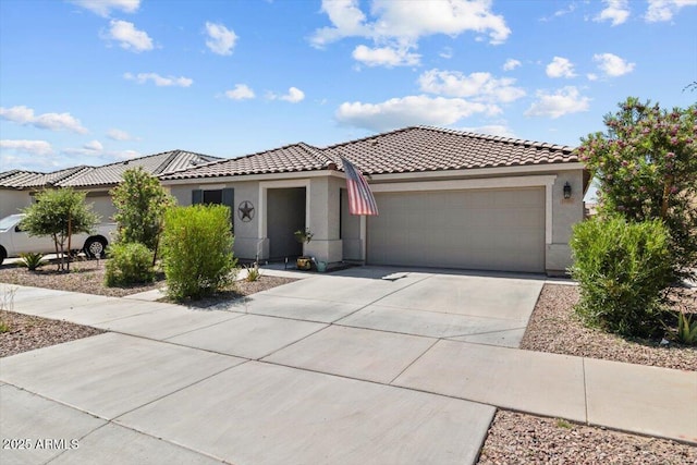 17461 W Molly Ln, Surprise, AZ 85387 - view of front of house with an attached garage, stucco siding, a tiled roof, and driveway