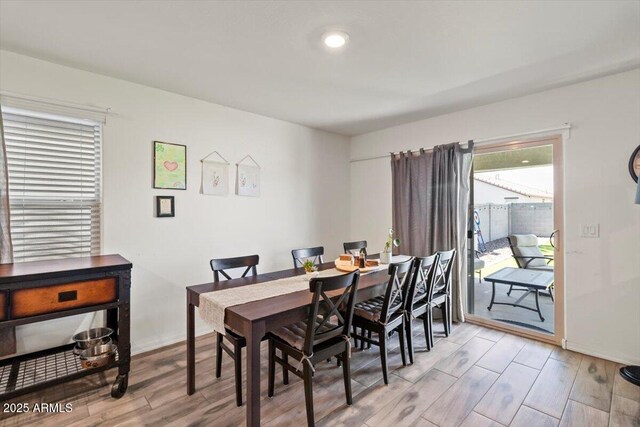 17461 W Molly Ln, Surprise, AZ 85387 - dining space with light wood-style floors and baseboards