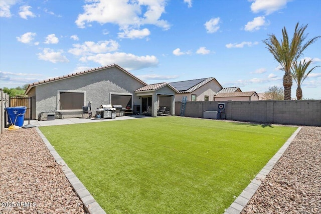 17461 W Molly Ln, Surprise, AZ 85387 - back of property featuring a patio, stucco siding, a tiled roof, and an outdoor living space
