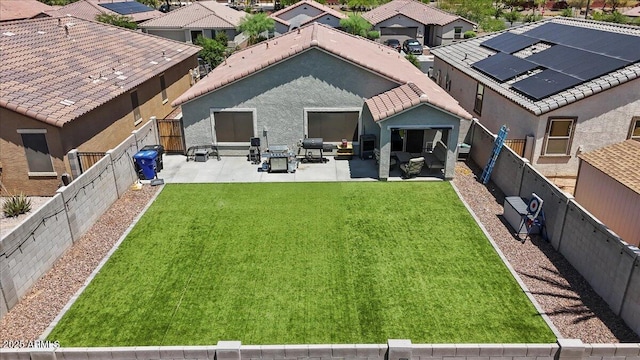 17461 W Molly Ln, Surprise, AZ 85387 - back of house featuring a patio, a residential view, and stucco siding