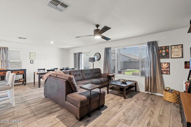 17461 W Molly Ln, Surprise, AZ 85387 - living area featuring light wood finished floors, plenty of natural light, a ceiling fan, and recessed lighting