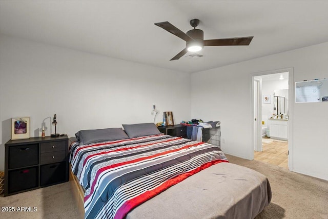 17461 W Molly Ln, Surprise, AZ 85387 - carpeted bedroom with connected bathroom and ceiling fan