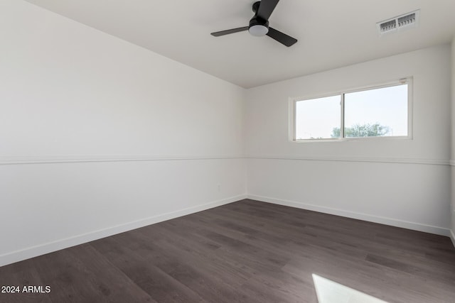 unfurnished room featuring ceiling fan and dark hardwood / wood-style floors