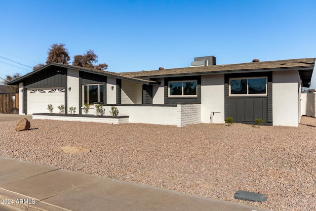 single story home featuring a garage