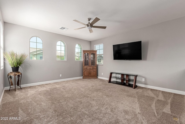 913 W Yosemite Dr, Chandler, AZ 85248 - unfurnished living room featuring ceiling fan, baseboards, and carpet floors