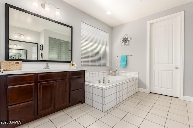 913 W Yosemite Dr, Chandler, AZ 85248 - bathroom featuring vanity, a garden tub, and tile patterned floors