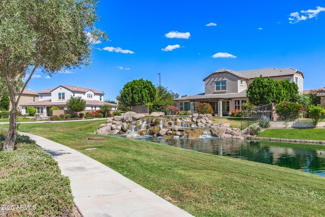 913 W Yosemite Dr, Chandler, AZ 85248 - surrounding community with a lawn and a water view