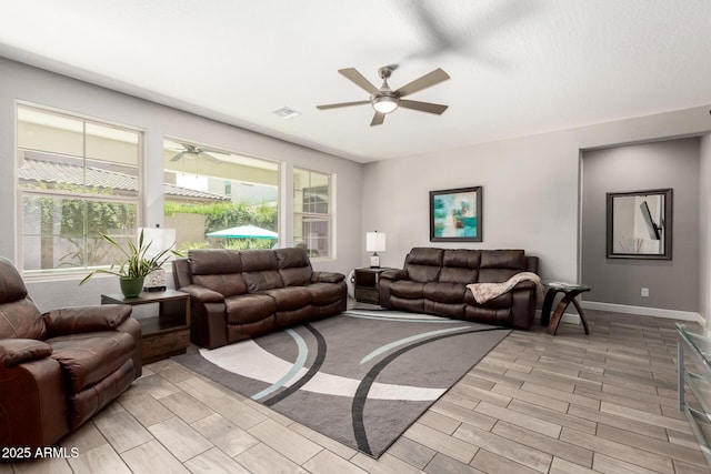 913 W Yosemite Dr, Chandler, AZ 85248 - living room with ceiling fan, baseboards, and light wood-style flooring