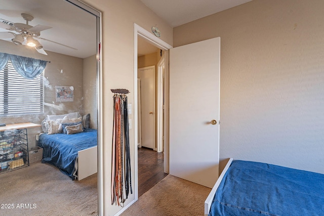 bedroom with ceiling fan and carpet floors