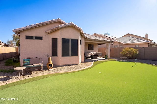 rear view of house with an outdoor hangout area and a patio