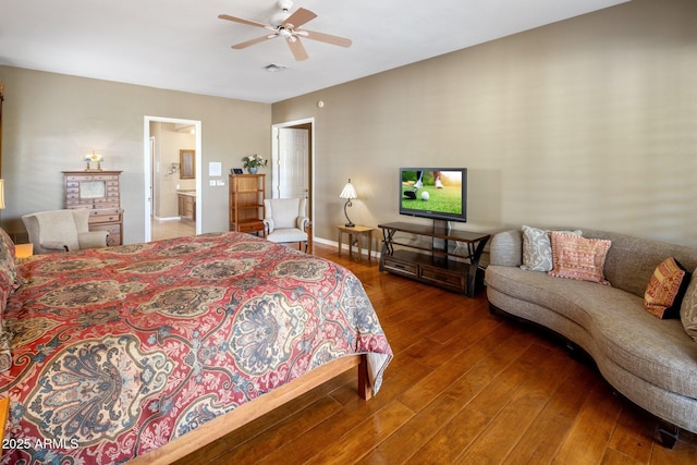 bedroom featuring hardwood / wood-style flooring, ceiling fan, and ensuite bathroom