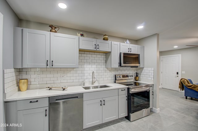 kitchen featuring sink, backsplash, and appliances with stainless steel finishes