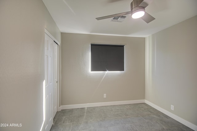 spare room with ceiling fan