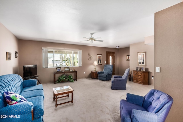 living room with ceiling fan and light carpet