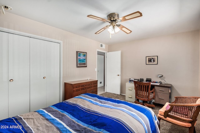 carpeted bedroom with ceiling fan and a closet