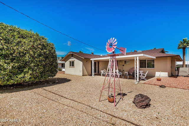 rear view of house with a patio area