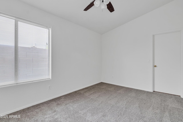 carpeted empty room with lofted ceiling and ceiling fan