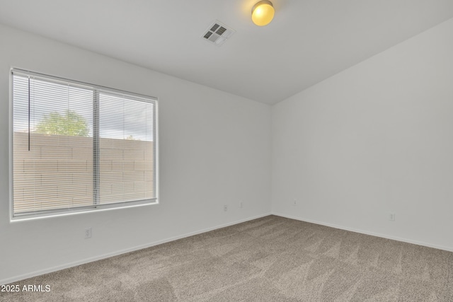 empty room featuring light colored carpet