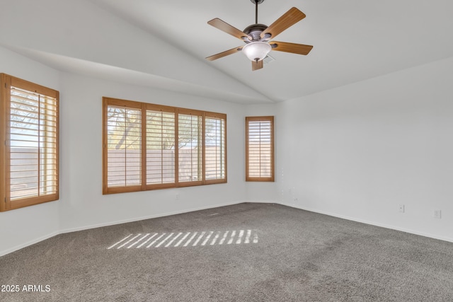 carpeted spare room with ceiling fan and lofted ceiling