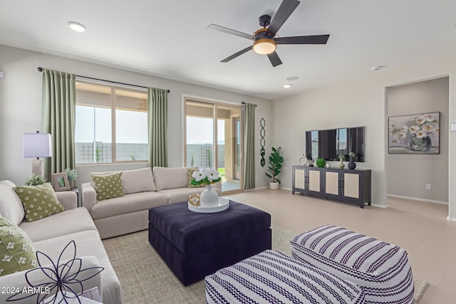 living area featuring ceiling fan, baseboards, and recessed lighting