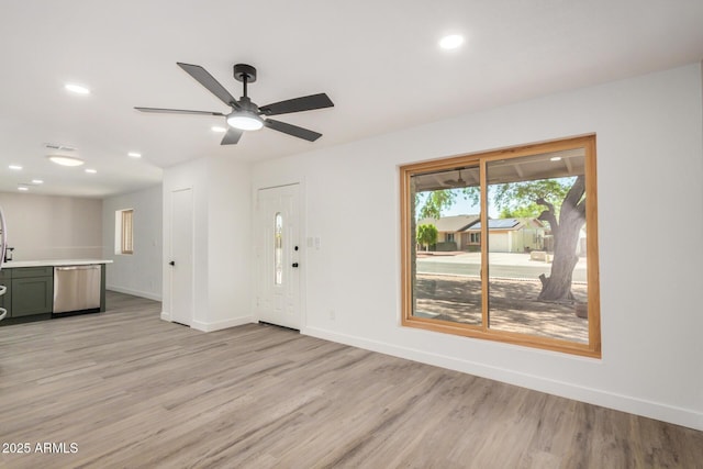 308 W Oraibi Dr, Phoenix, AZ 85027 - unfurnished living room with light wood-type flooring, recessed lighting, and a ceiling fan