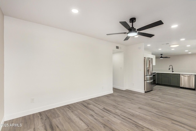 308 W Oraibi Dr, Phoenix, AZ 85027 - unfurnished living room with ceiling fan, light wood-style floors, and recessed lighting