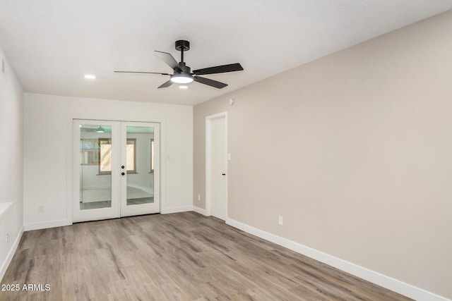 308 W Oraibi Dr, Phoenix, AZ 85027 - spare room with french doors, wood finished floors, ceiling fan, and recessed lighting
