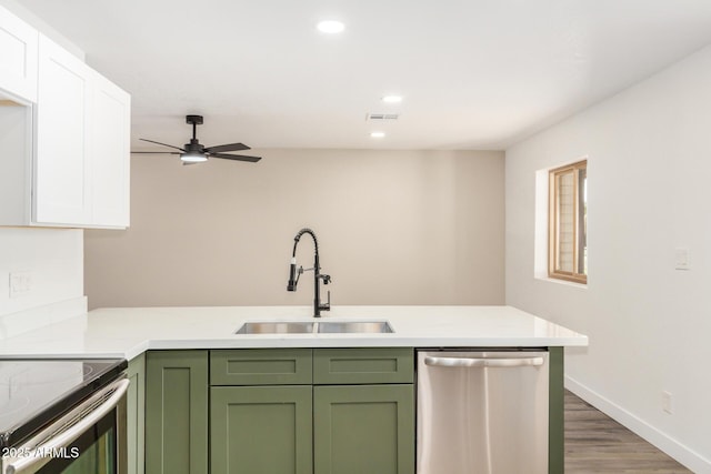 308 W Oraibi Dr, Phoenix, AZ 85027 - kitchen with stainless steel dishwasher, green cabinets, white cabinets, light countertops, and recessed lighting