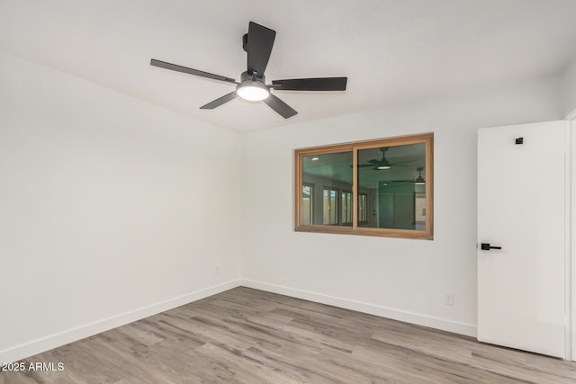 308 W Oraibi Dr, Phoenix, AZ 85027 - spare room with wood finished floors and a ceiling fan