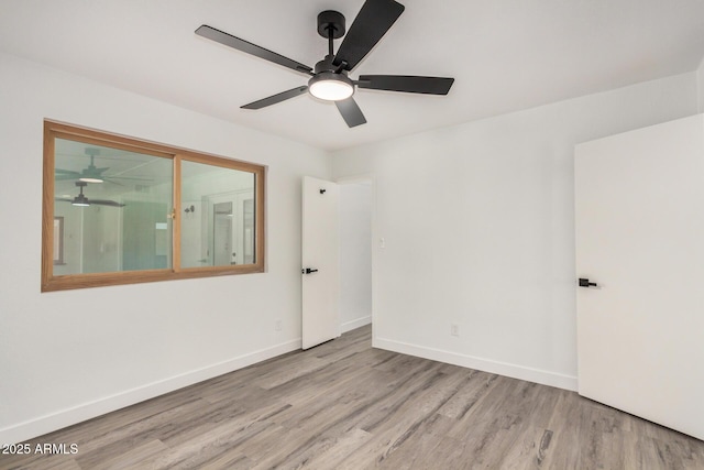 308 W Oraibi Dr, Phoenix, AZ 85027 - spare room featuring wood finished floors and ceiling fan