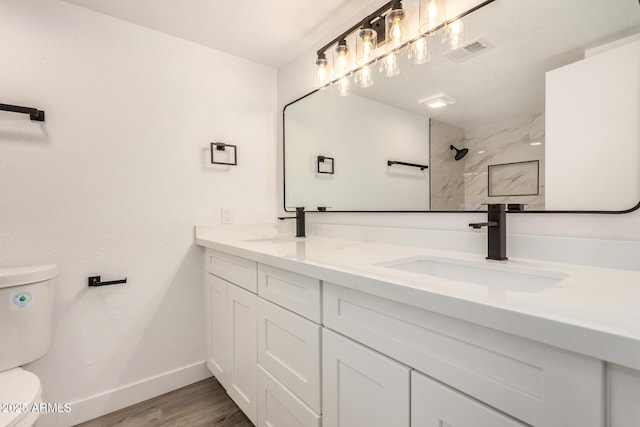 308 W Oraibi Dr, Phoenix, AZ 85027 - bathroom featuring double vanity, wood finished floors, and a shower