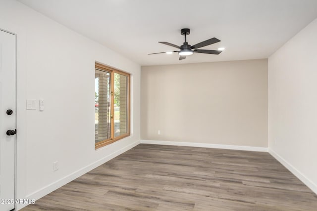 308 W Oraibi Dr, Phoenix, AZ 85027 - unfurnished room featuring ceiling fan and wood finished floors