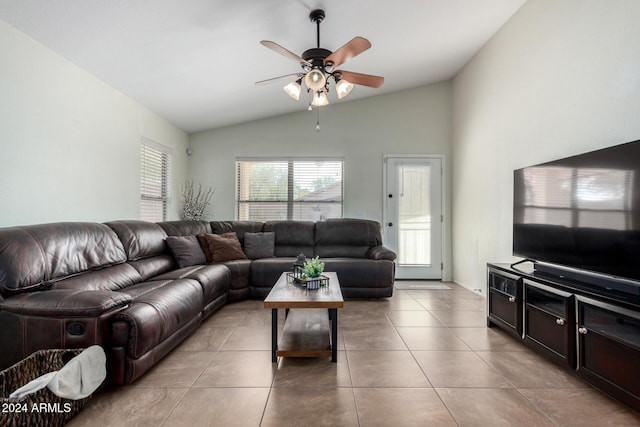 tiled living room with ceiling fan and lofted ceiling