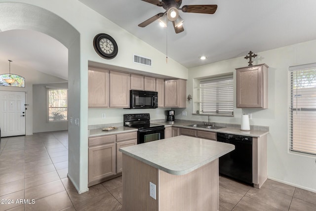 kitchen with a center island, decorative light fixtures, vaulted ceiling, and black appliances