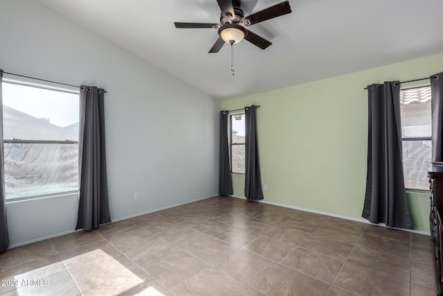 unfurnished room featuring ceiling fan and lofted ceiling